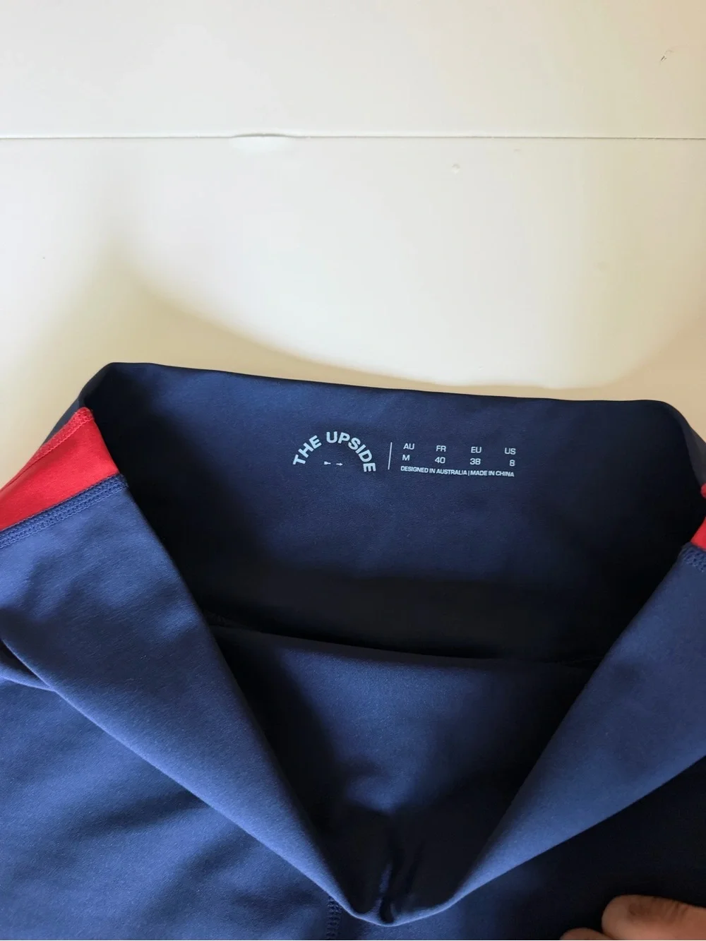 The Upside Navy Leggings with Red and White Side Stripes
